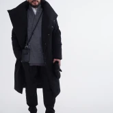 Длинное зимнее пальто на кнопках черного цвета